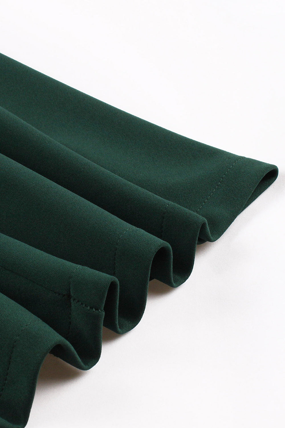 Mørkegrøn V-hals enkeltradet 1950'er kjole