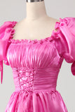Pufærmer Hot Pink gallakjole med flæser