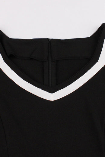 V-hals korte ærmer Sort kjole fra 1950'erne med bælte