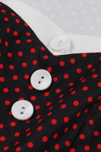 Sorte prikker 1950'ernes kjole med knap