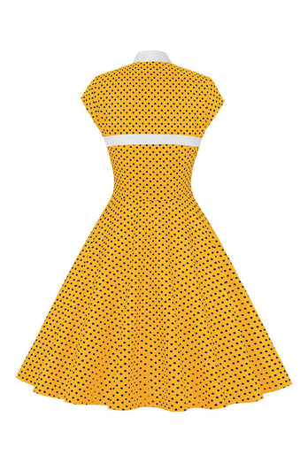 Sorte prikker 1950'ernes kjole med knap