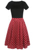 Indlæs billede til gallerivisning Kjole med bådhals trykt i sort kjole fra 1950&#39;erne med korte ærmer