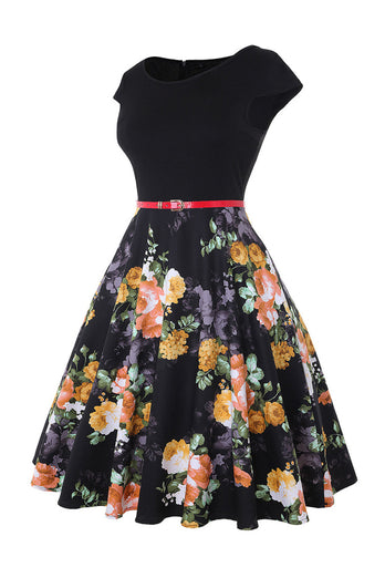 Bådhals blomstertrykt sort kjole fra 1950'erne med bælte