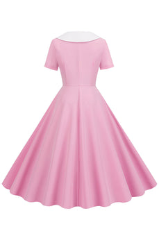 En linje pink kort ærmeløs kjole fra 1950'erne