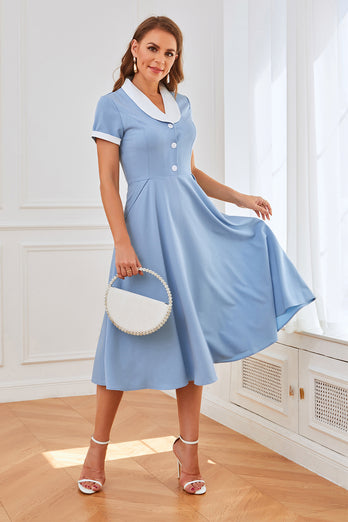 Blå swingkjole fra 1950'erne med lommer